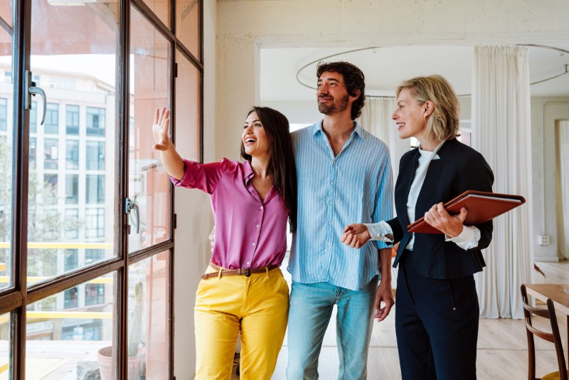 Real estate agent showing an apartment to a couple