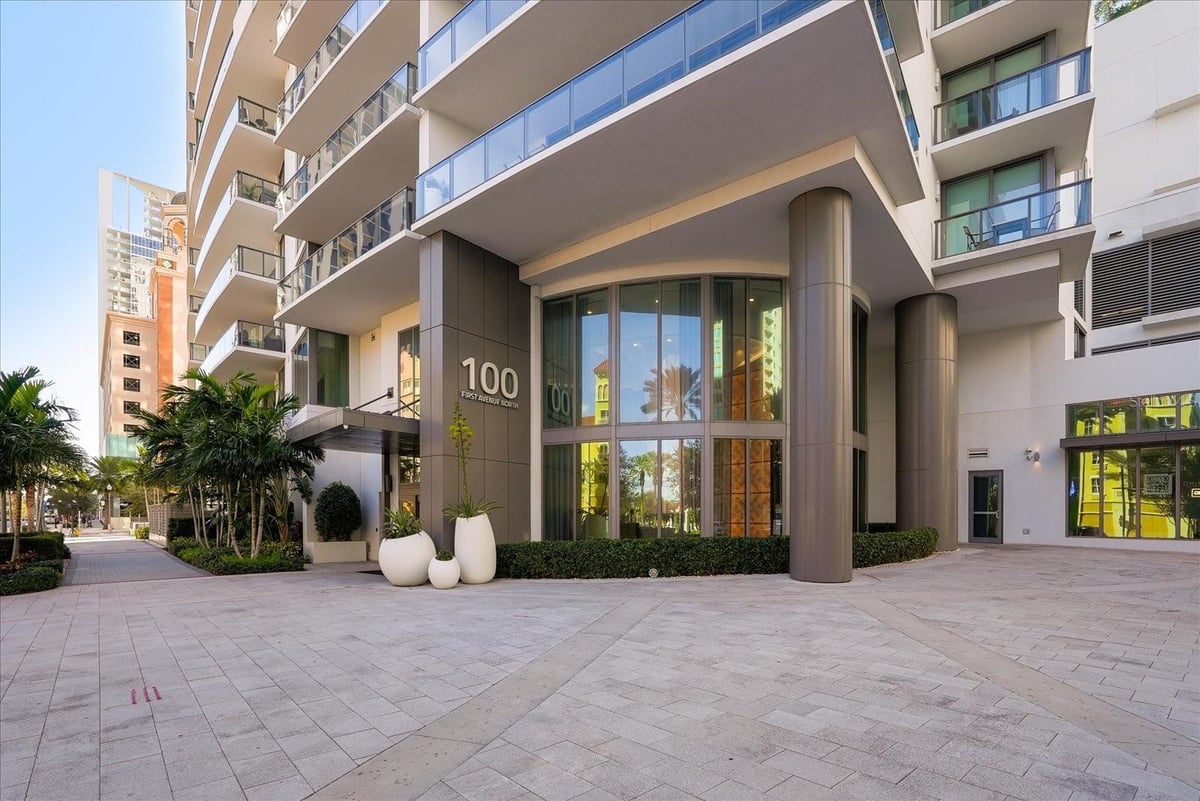 Modern apartment building entrance with covered drop-off area